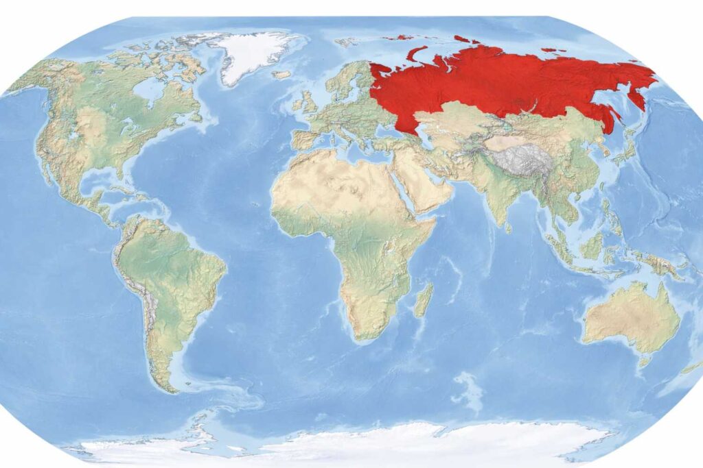 World physical map showing Russia highlighted in red – Russia itna powerful kaise hai